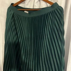 Green pleated skirt
